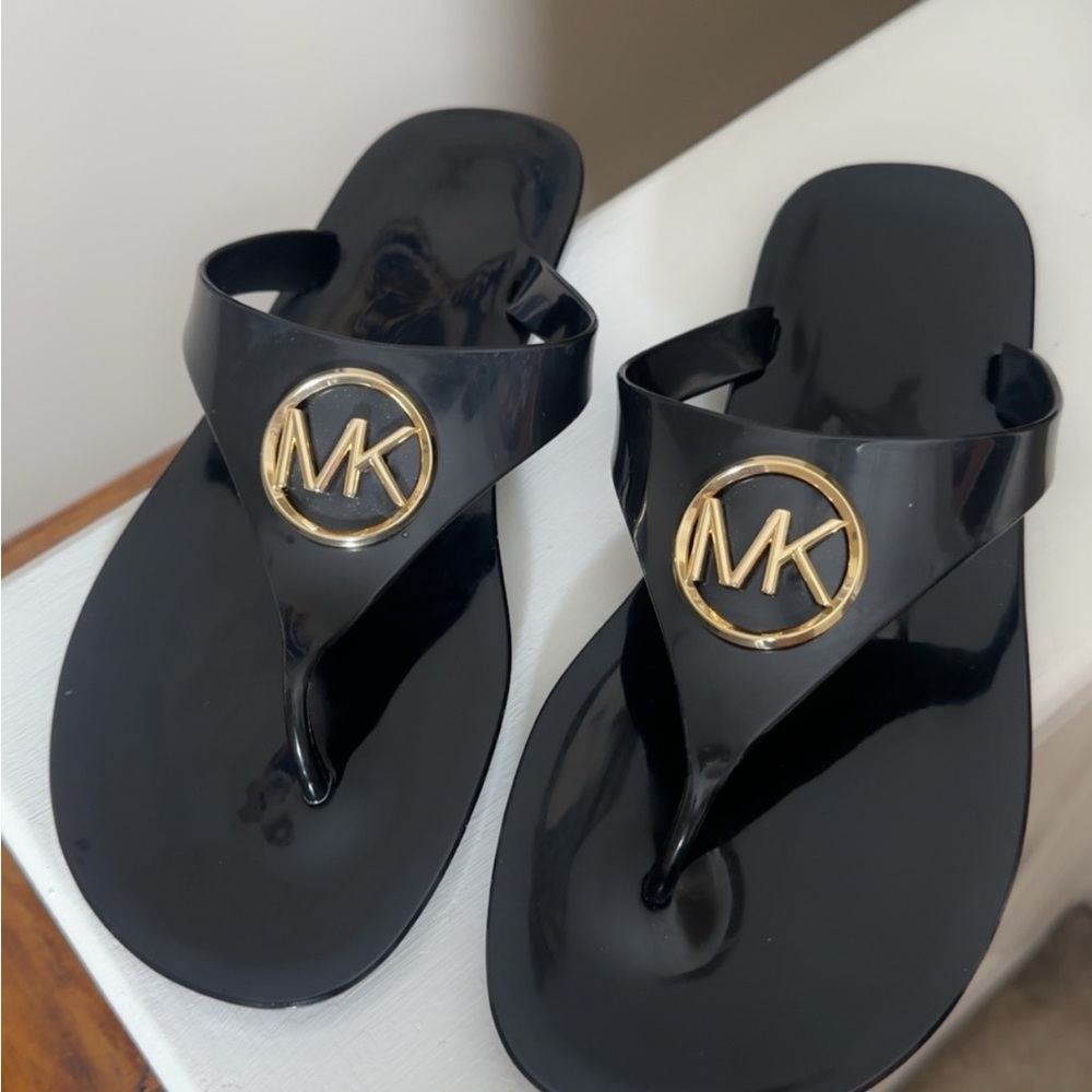 Michael Kors Glossy Black Flip Flops with Gold Emblem